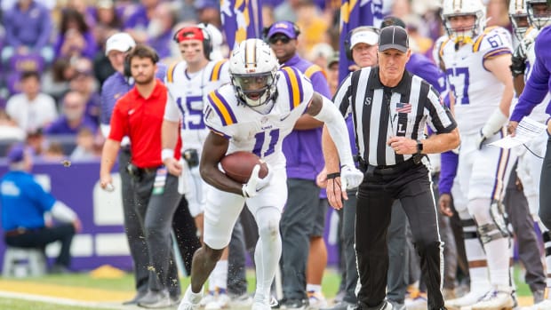 Brian Thomas Jr 11 runs the ball as the LSU Tigers take on Texas A&M in Tiger Stadium in Baton Rouge, Louisiana, November 25, 2023.